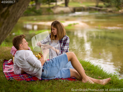 Image of Couple in love enjoying picnic time