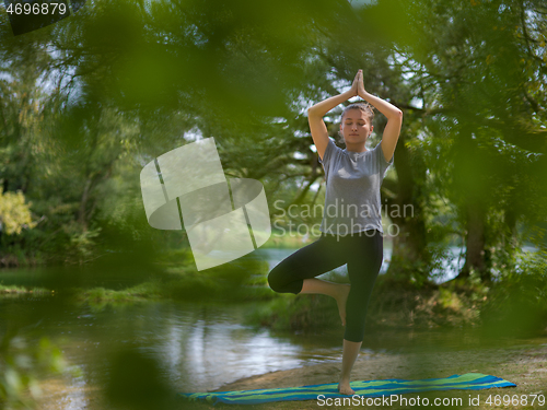 Image of woman meditating and doing yoga exercise