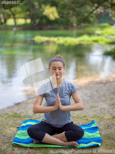 Image of woman meditating and doing yoga exercise