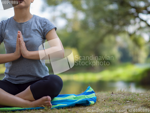 Image of woman meditating and doing yoga exercise