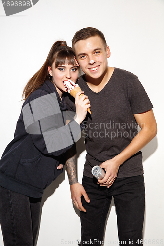 Image of Close up fashion portrait of two young pretty hipster teens