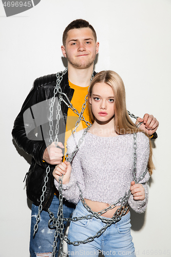 Image of Close up fashion portrait of two young pretty hipster teens