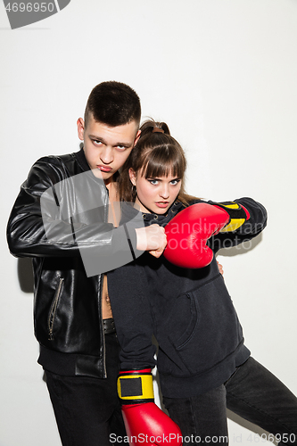 Image of Close up fashion portrait of two young pretty hipster teens