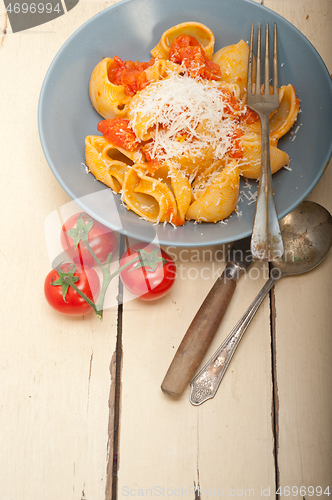 Image of Italian snail lumaconi pasta with tomatoes