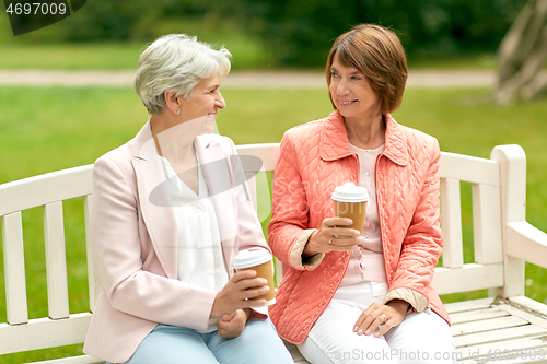 Image of senior women or friends drinking coffee at park