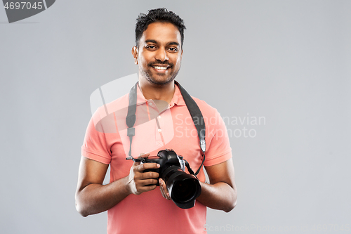 Image of indian man or photographer with digital camera