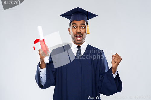 Image of happy graduate student in mortarboard with diploma