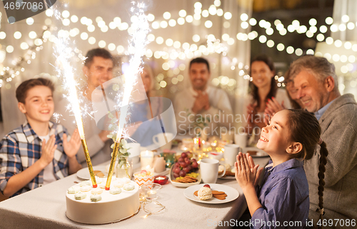 Image of happy family having dinner party at home