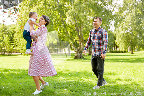 Image of happy family having fun at summer park