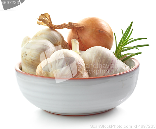 Image of garlic, onion and rosemary in ceramic bowl