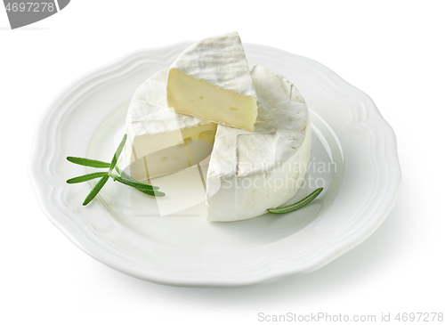 Image of fresh brie cheese on white plate