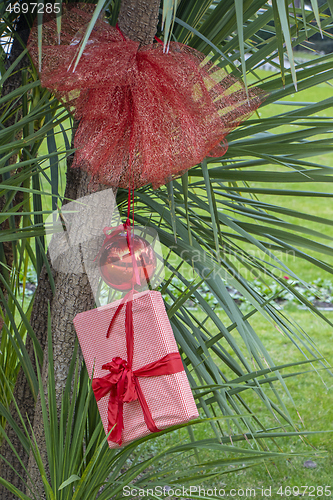 Image of Christmas decoration with with red Christmas ball and a gift pac