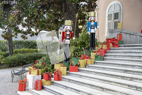 Image of Wooden figures of the Nutcracker and gift boxes as Christmas dec