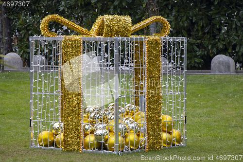 Image of Christmas decoration as gift boxes with Christmas balls in a cit