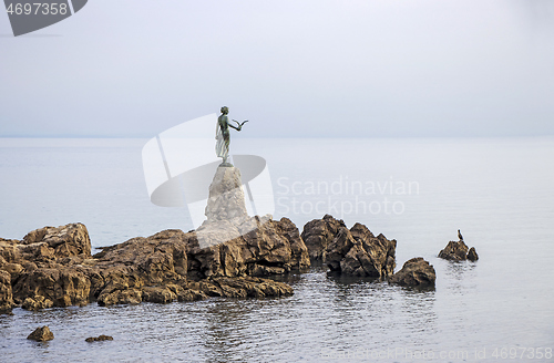 Image of Sculpture of the woman Mermaid with the sea at Opatija