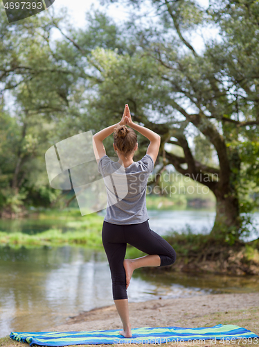 Image of woman meditating and doing yoga exercise