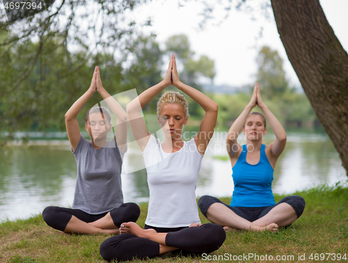 Image of women meditating and doing yoga exercise