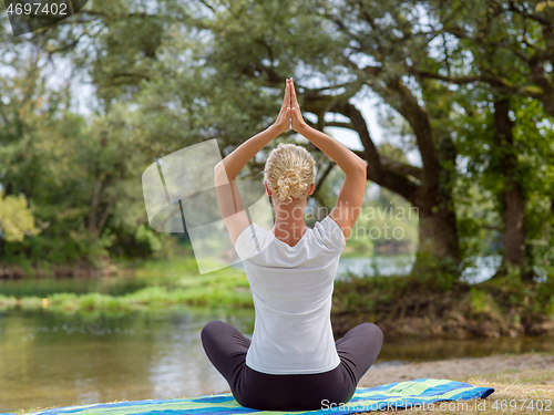 Image of woman meditating and doing yoga exercise