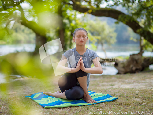 Image of woman meditating and doing yoga exercise