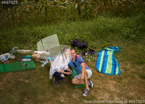 Image of Couple in love enjoying picnic time