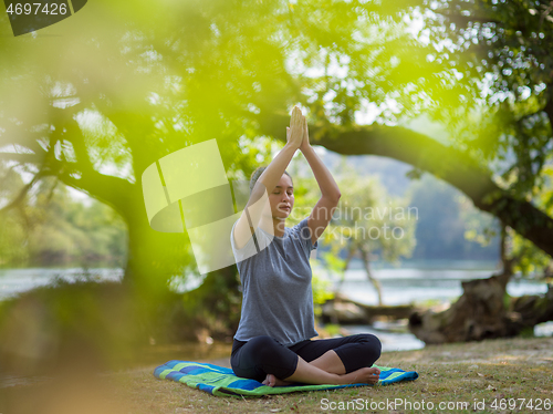 Image of woman meditating and doing yoga exercise