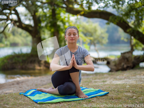 Image of woman meditating and doing yoga exercise
