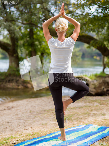 Image of woman meditating and doing yoga exercise