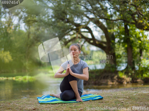 Image of woman meditating and doing yoga exercise