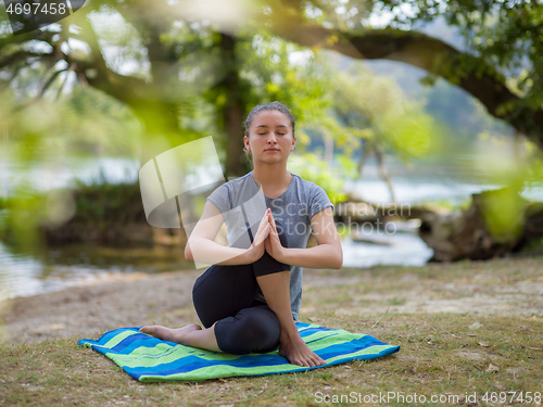 Image of woman meditating and doing yoga exercise