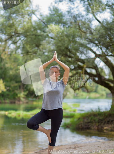 Image of woman meditating and doing yoga exercise