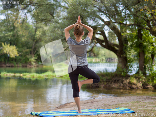 Image of woman meditating and doing yoga exercise