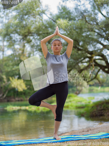 Image of woman meditating and doing yoga exercise