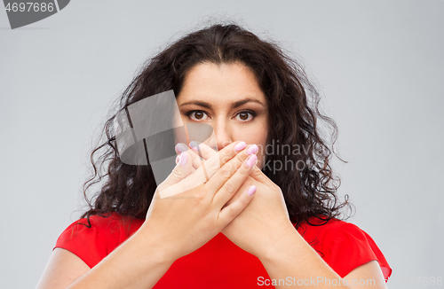 Image of woman in red dress over grey background