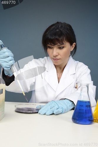 Image of Scientist extracting sample