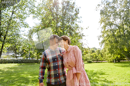 Image of happy couple in summer park