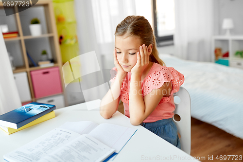 Image of sad student girl with notebook at home