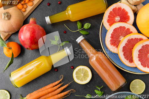 Image of glass bottles of fruit and vegetable juices