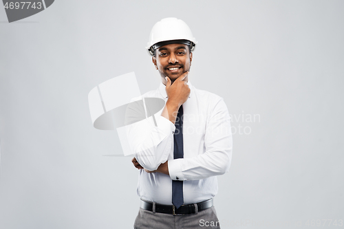 Image of indian male architect in helmet over grey