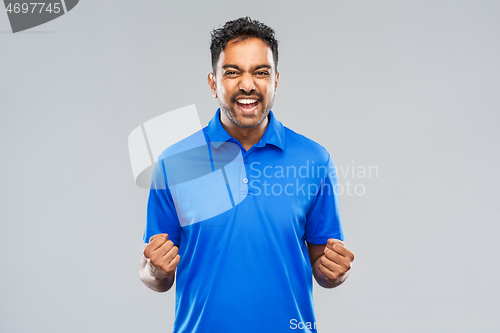 Image of happy indian man celebrating victory