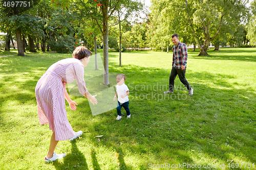 Image of happy family having fun at summer park