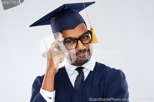 Image of indian graduate student in mortar board thinking