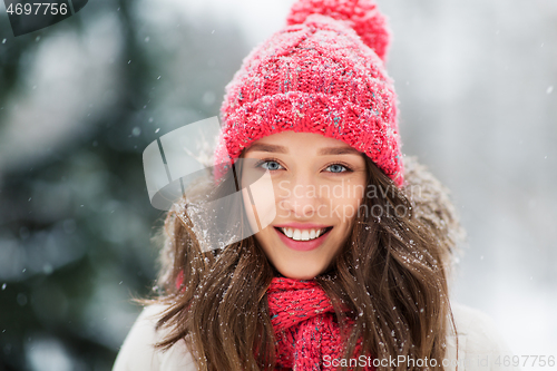 Image of smiling teenage girl outdoors in winter