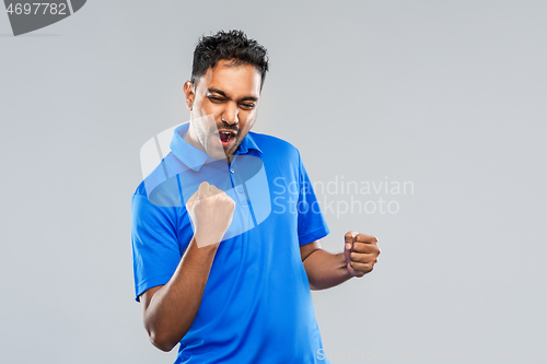 Image of happy indian man celebrating victory