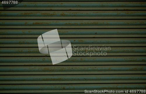 Image of Old rusting metal security shutters texture