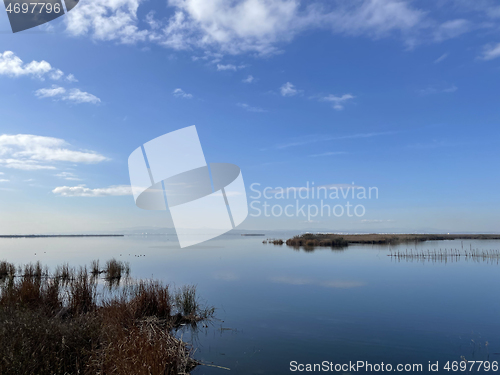 Image of Tranquil lake or estuary at sunrise or sunset