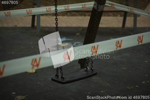 Image of Swing in a kids playground cordoned off