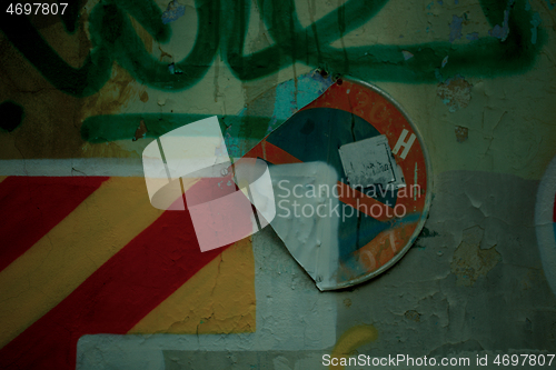 Image of Old wall with graffiti and damaged No Entry sign