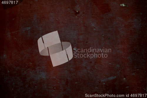 Image of Old dark red rusty metal panel background texture