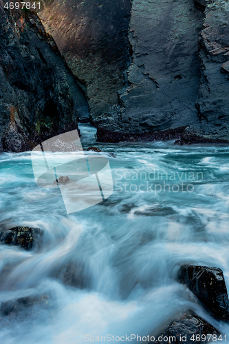 Image of Ocean flowing through a cave tunnel