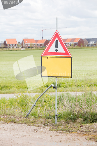 Image of Red and white road traffic warning sign